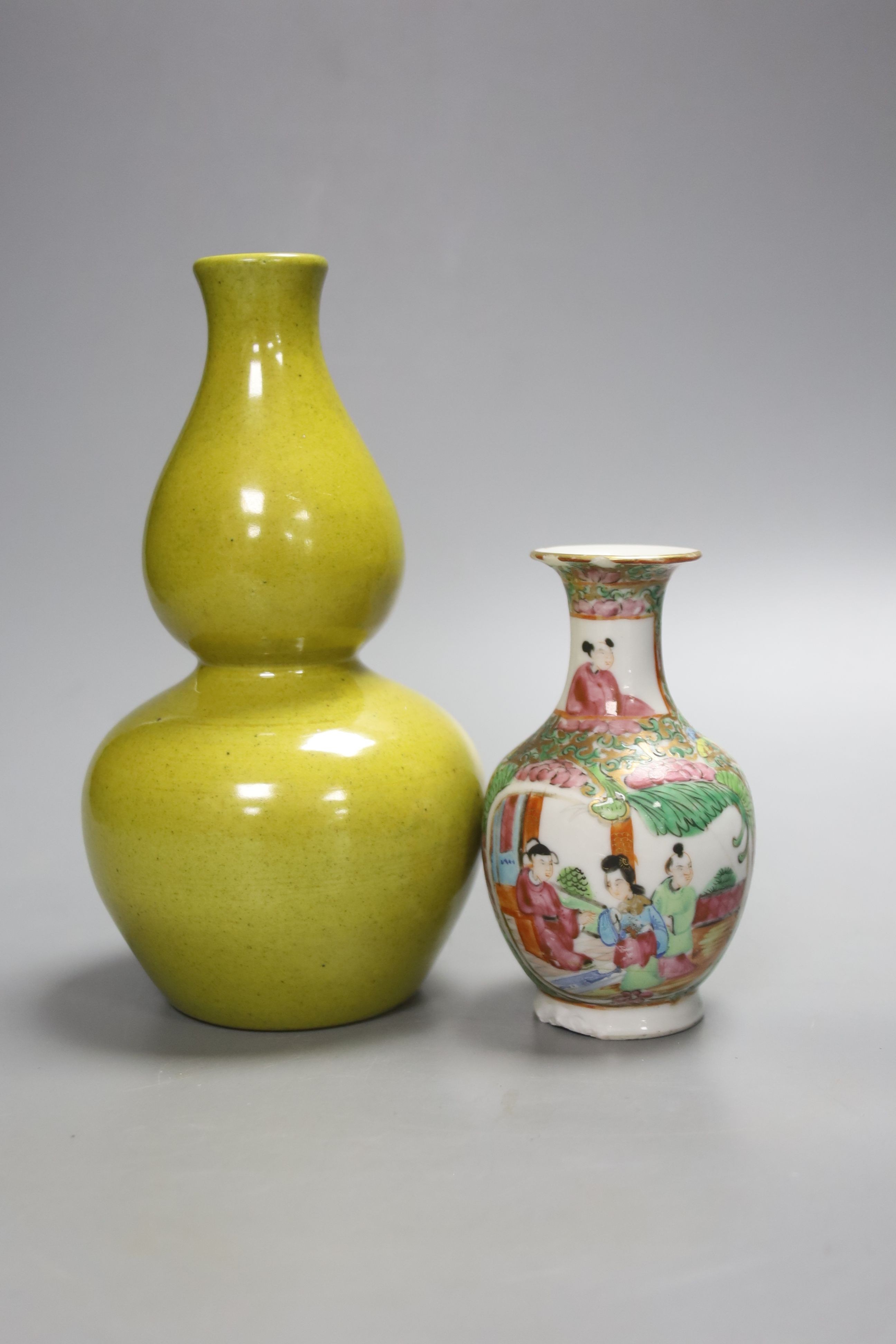 A Chinese yellow ground double gourd vase and a similar famille rose baluster vase, tallest 18cm